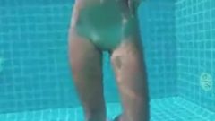 Teen With Long Hairs Swim Underwater In Pool